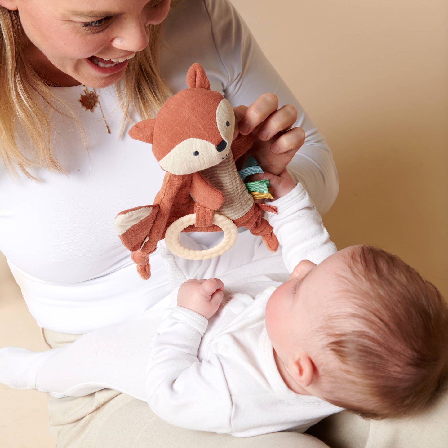 Bitzy Crinkle™ Sensory Toy With Teether: Dino