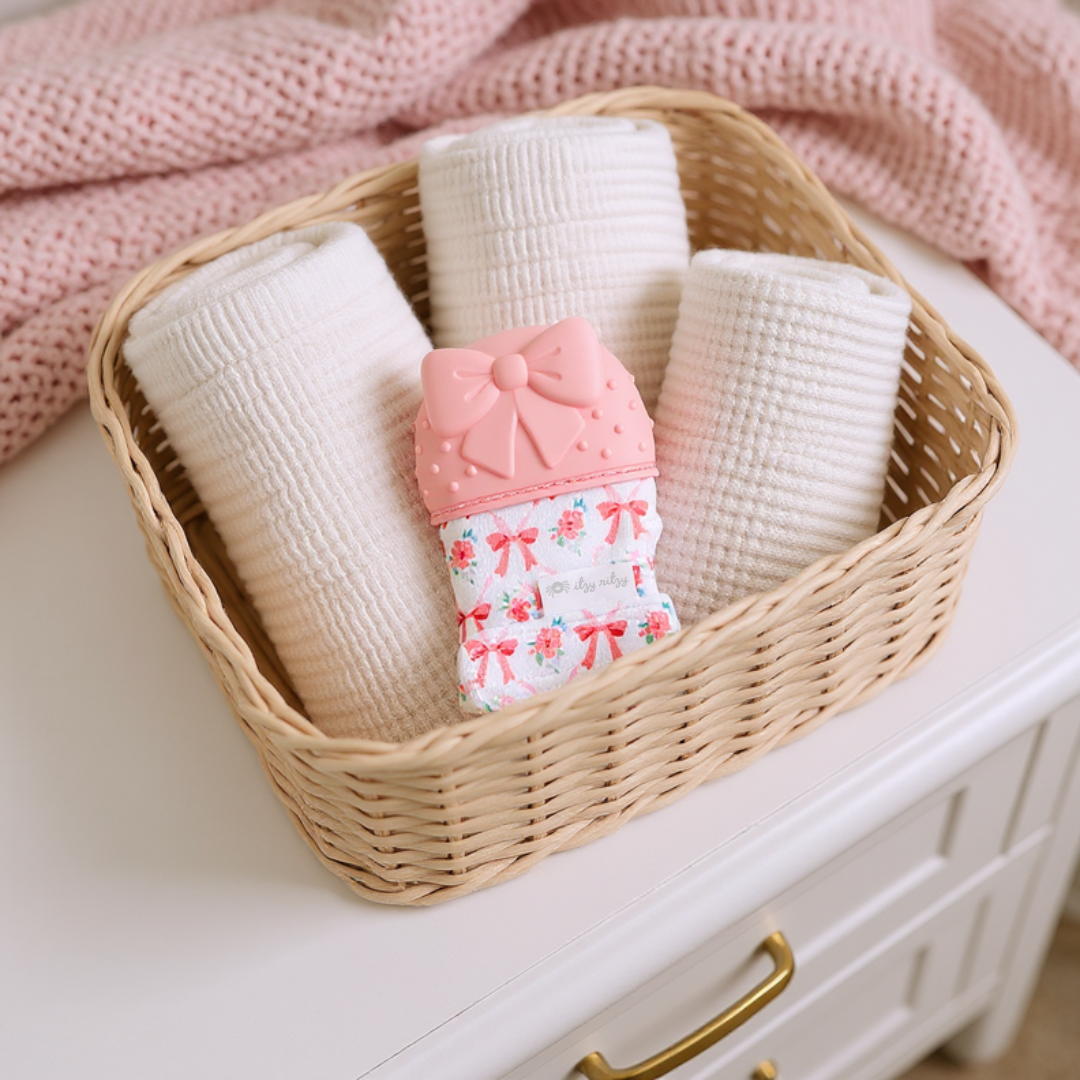 Itzy Mitt™ Silicone Teething Mitts: Bow