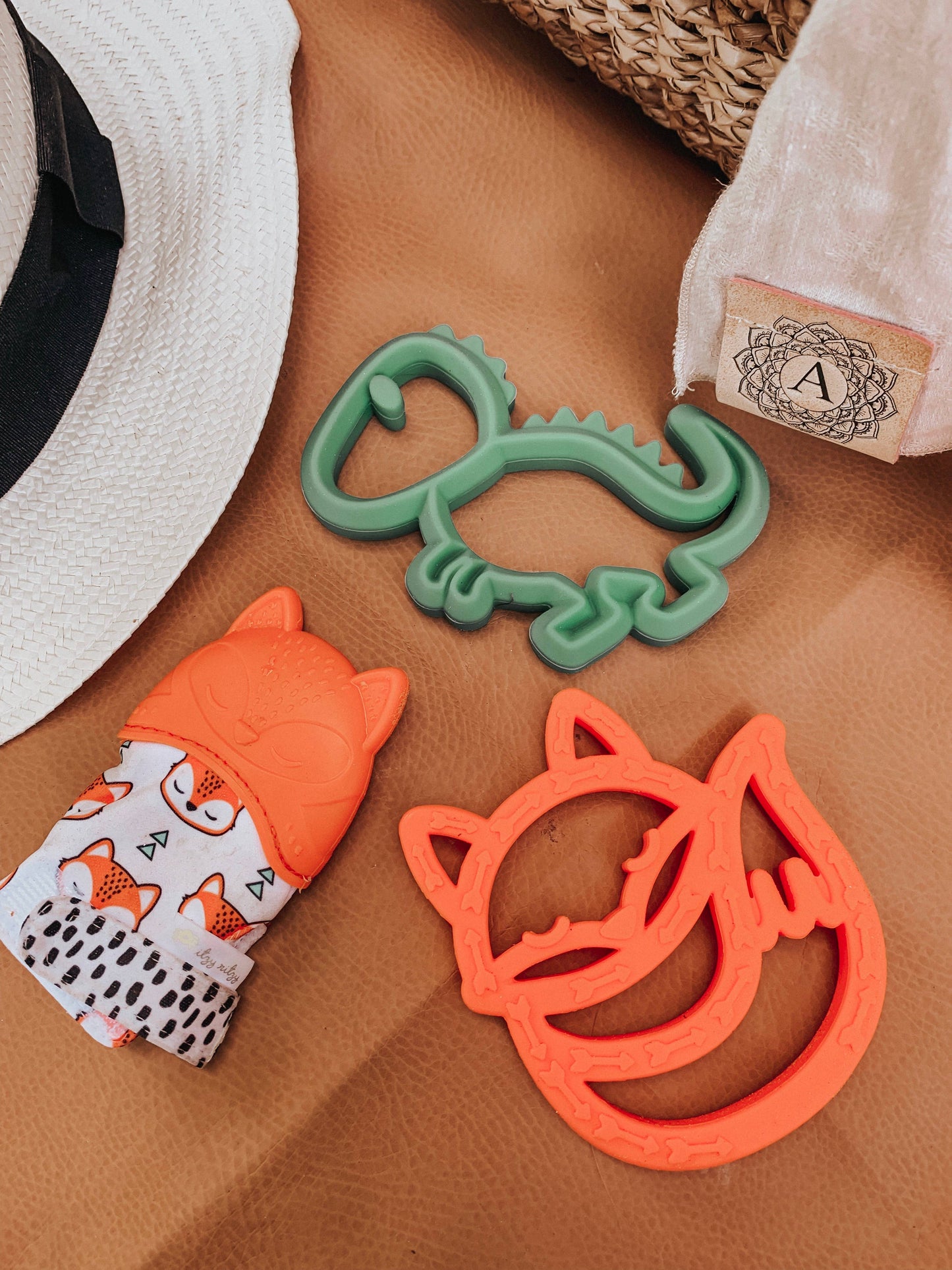 Itzy Mitt™ Silicone Teething Mitts: Highland Cow