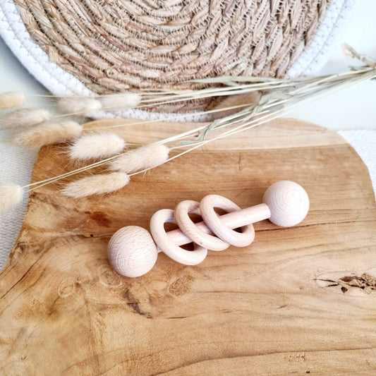 Wooden rattle with rings